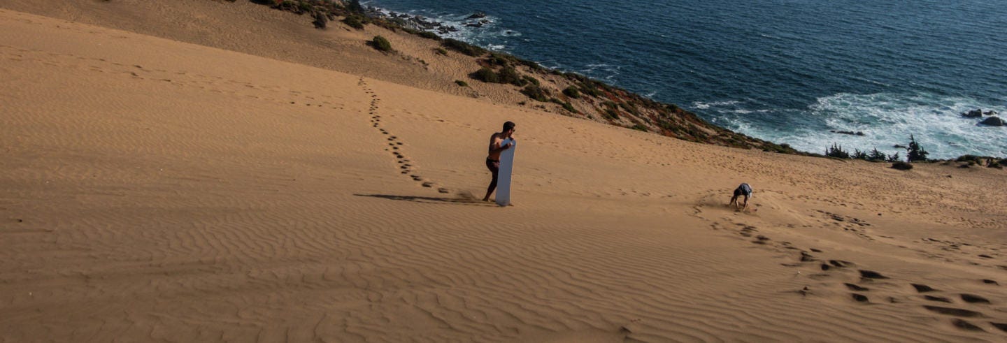 Sandboarding in the Concon Dunes