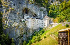 Predjama Castle and Postojna Cave Trip