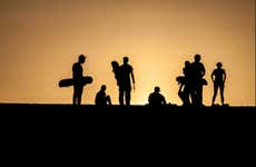 Sandboarding in the Ica Desert at Sunset